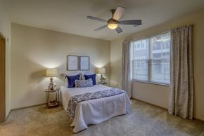 Madison apartment for rent - a bedroom with a bed and a ceiling fan