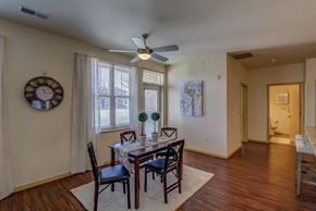 Madison apartment for rent - a dining room with a table and chairs and a ceiling fan