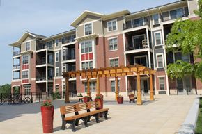 Madison apartment for rent - an apartment building with a patio and benches