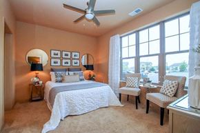 Madison apartment for rent - a bedroom with a large bed and a ceiling fan