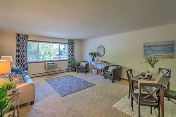 Monona apartment for rent - a living room with a couch and a table