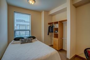 Madison apartment for rent - a bedroom with a white bed and a closet