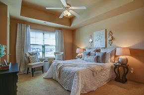 Madison apartment for rent - a bedroom with a large bed and a ceiling fan