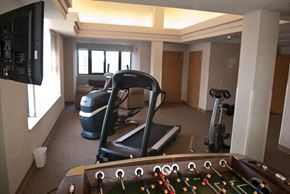 Madison apartment for rent - a gym with a treadmill and a pool table