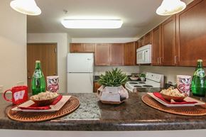 Madison apartment for rent - a kitchen with a counter with plates of food on it