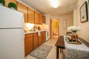 Madison apartment for rent - a kitchen with a table and a refrigerator