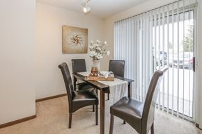 Verona apartment for rent - a dining room with a table and chairs and a sliding glass door