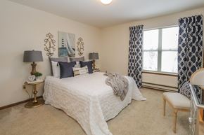 Verona apartment for rent - a bedroom with a bed and a window with curtains