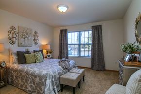 Fitchburg apartment for rent - a bedroom with a bed and a window