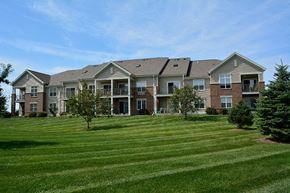Deforest apartment for rent - a large lawn in front of an apartment building