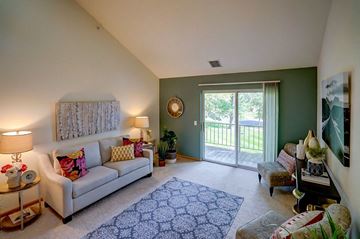 Madison apartment for rent - a living room with a couch and a sliding glass door