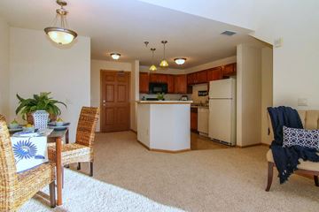 Madison apartment for rent - a living room and kitchen with a table and chairs