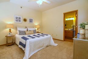 Madison apartment for rent - a bedroom with a bed and a mirror