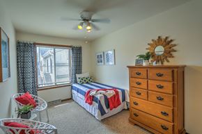 Madison apartment for rent - a bedroom with a bed and a dresser
