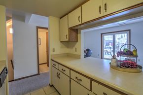 Madison apartment for rent - a kitchen with a counter top and a door to a living room