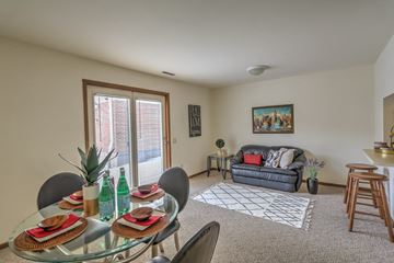 Madison apartment for rent - a living room with a glass dining table and a couch