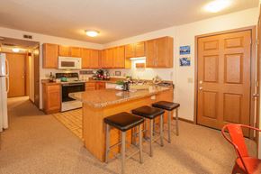 Madison apartment for rent - a kitchen with a counter and three stools