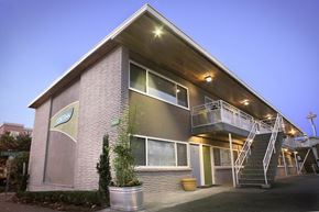 Seattle apartment for rent - the exterior of a building with a staircase and a balcony