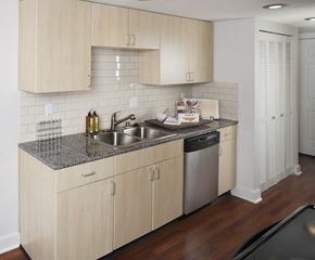 Bellevue apartment for rent - A kitchen with wooden cabinets and a granite countertop.