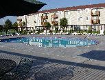 Omaha apartment for rent - an empty swimming pool in front of an apartment building