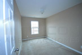 Charlotte house for rent - an empty room with a window and a door