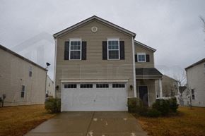 Charlotte house for rent - a white garage door in front of a house