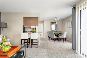 Louisville apartment for rent - Open floor plan at Brookside Apartment Homes with carpet flooring and beige walls