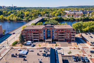 Eau Claire apartment for rent - an aerial view of a building with a river in the background