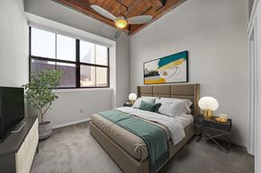 Philadelphia apartment for rent - a bedroom with a bed and a ceiling fan