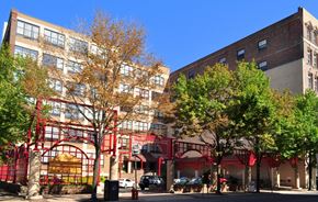 Philadelphia apartment for rent - a view of a city street with buildings and trees