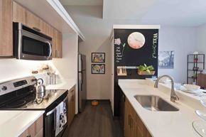 Philadelphia apartment for rent - a kitchen with white counter tops and a sink