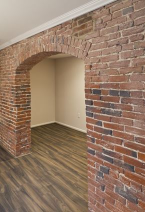 Philadelphia apartment for rent - an empty room with a brick wall and wood floors