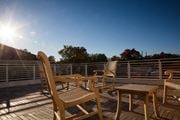 Colonia apartment for rent - a deck with chairs and a table on a balcony