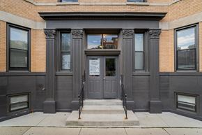Chicago apartment for rent - the front of a building with gray doors and windows