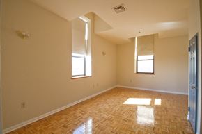 Newark apartment for rent - Living room with hardwood floors and beige walls