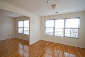 Newark apartment for rent - Living room with white walls and hardwood floors