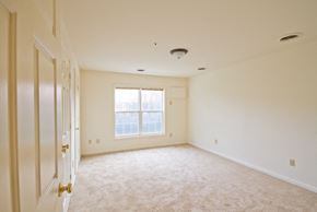 Newark apartment for rent - bedroom with white walls and carpeted floors