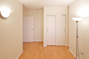 Newark apartment for rent - Bedroom with sliding door closets and wall lamps