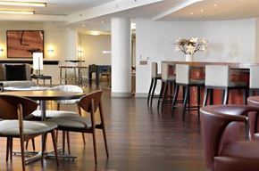 Washington apartment for rent - A modern dining room with a round table and chairs.