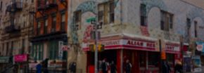 New York apartment for rent - a blurry picture of a restaurant on a city street