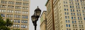 New York apartment for rent - a street light in front of tall buildings