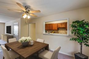 Glen Burnie apartment for rent - a dining room with a table and chairs and a ceiling fan