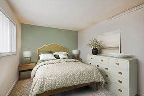Woodbridge apartment for rent - a bedroom with a bed and a dresser