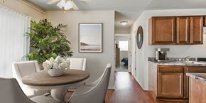 Woodbridge apartment for rent - a kitchen and dining room with a table and chairs