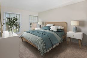 Crofton apartment for rent - a bedroom with a bed and two windows