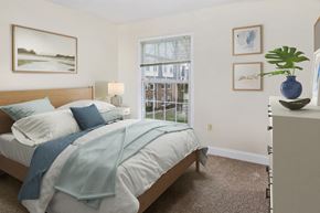 Crofton apartment for rent - a bedroom with a bed and a large window