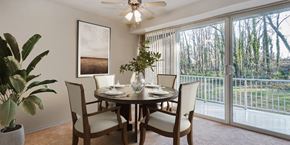 Hillcrest Heights apartment for rent - a dining room with a table and chairs and a sliding glass door