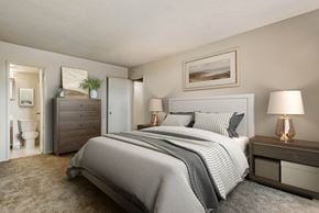 Falls Church apartment for rent - a bedroom with a bed and a bathroom with a toilet