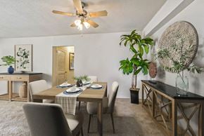 Falls Church apartment for rent - a dining room with a table and chairs and a ceiling fan
