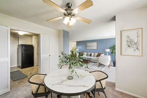 Silver Spring apartment for rent - a dining room with a table and a ceiling fan